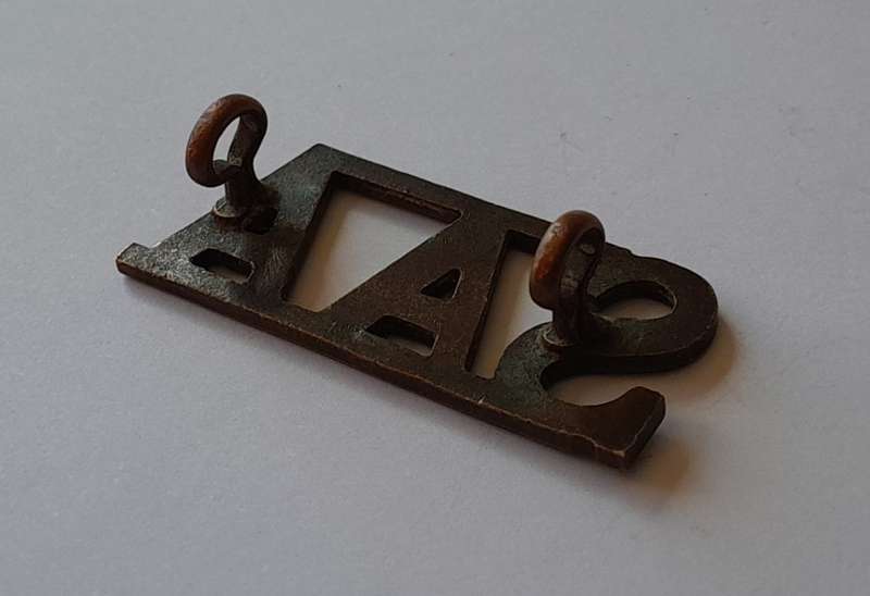 South Africa Army Artillery Brass Title. Lugs Intact.