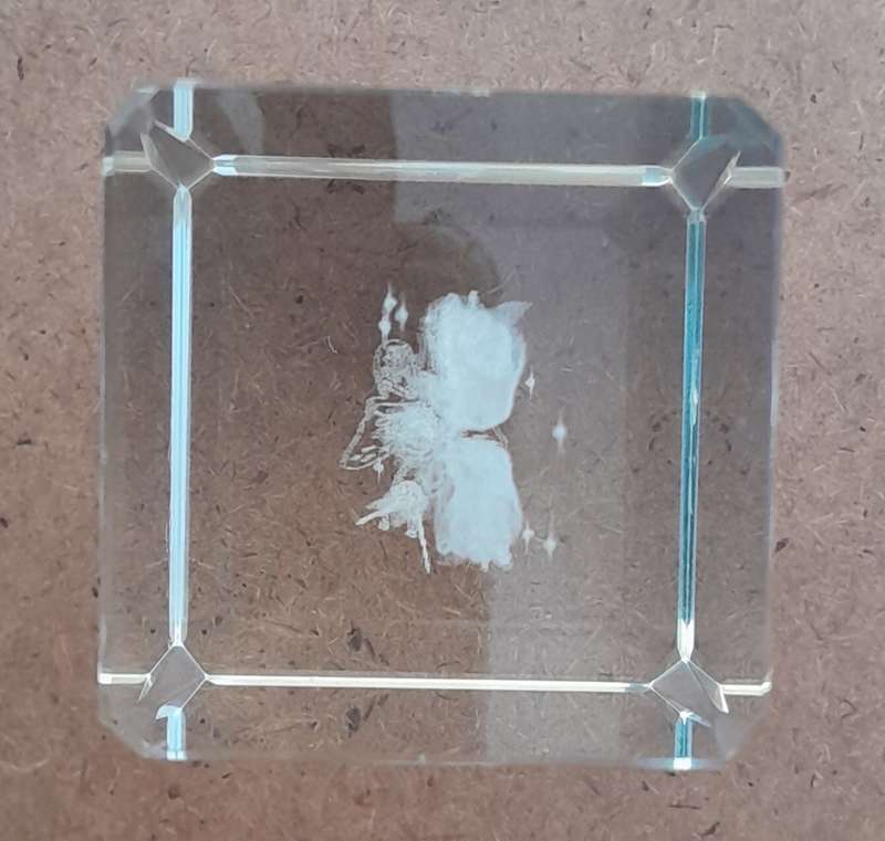 A Three-Dimensional Laser Etched Glass Crystal Paperweight In Original Case.