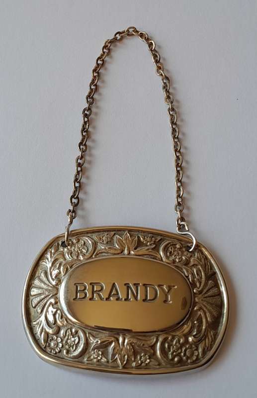 A Vintage Silver Plated `BRANDY` Bottle Decanter Label By `Ianthe, England`.
