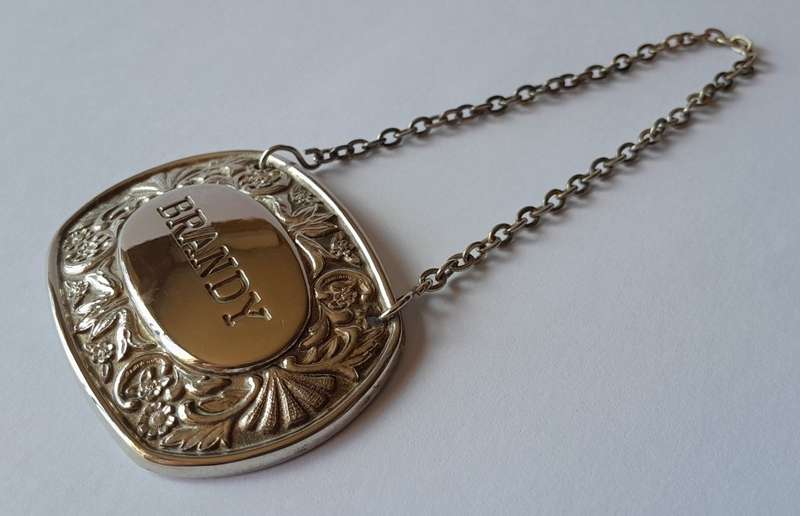 A Vintage Silver Plated `BRANDY` Bottle Decanter Label By `Ianthe, England`.