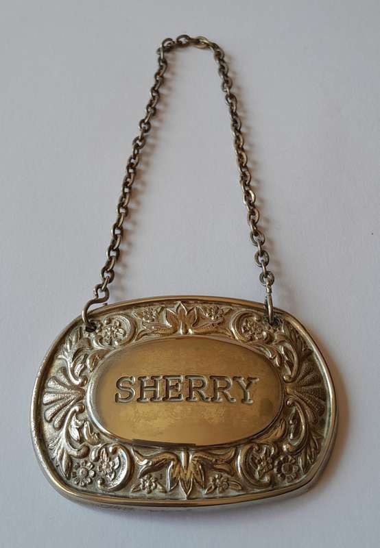 A Vintage Silver Plated `SHERRY` Bottle Decanter Label By `Ianthe, England`.