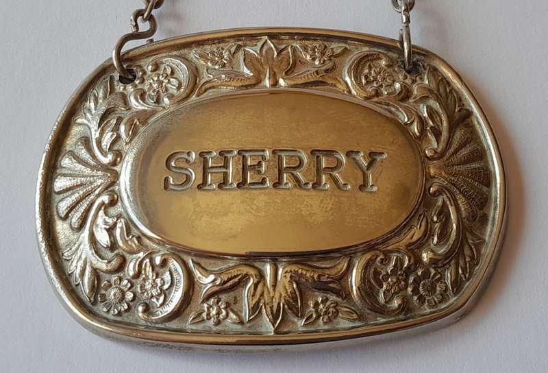 A Vintage Silver Plated `SHERRY` Bottle Decanter Label By `Ianthe, England`.
