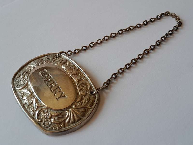 A Vintage Silver Plated `SHERRY` Bottle Decanter Label By `Ianthe, England`.