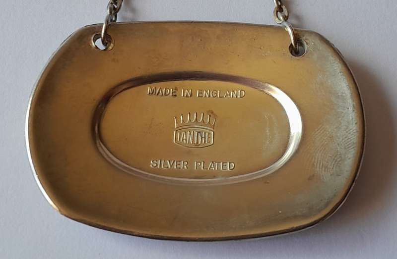 A Vintage Silver Plated `SHERRY` Bottle Decanter Label By `Ianthe, England`.