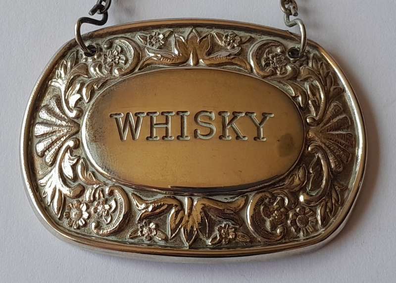 A Vintage Silver Plated `WHISKY` Bottle Decanter Label By `Ianthe, England`.