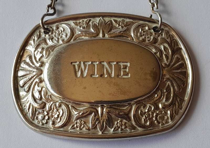 A Vintage Silver Plated `WINE` Bottle Decanter Label By `Ianthe, England`. (1 of 2).