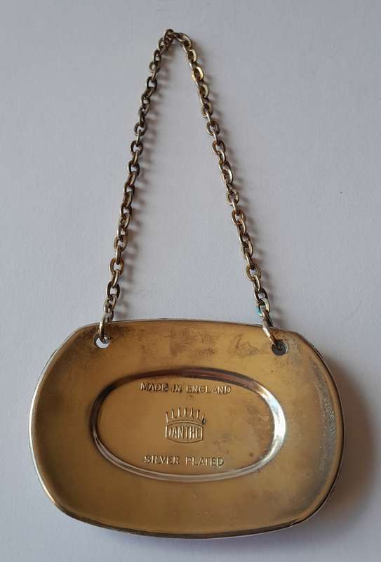 A Vintage Silver Plated `WINE` Bottle Decanter Label By `Ianthe, England`. (1 of 2).
