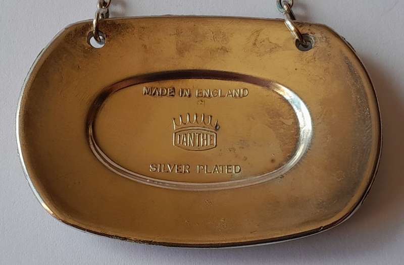 A Vintage Silver Plated `WINE` Bottle Decanter Label By `Ianthe, England`. (1 of 2).
