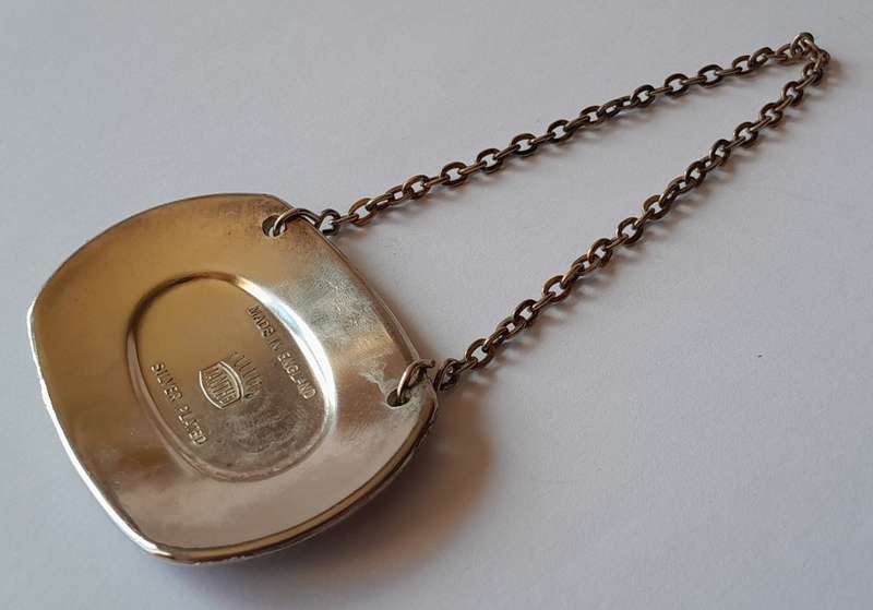 A Vintage Silver Plated `WINE` Bottle Decanter Label By `Ianthe, England`. (1 of 2).