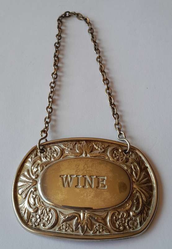 A Vintage Silver Plated `WINE` Bottle Decanter Label By `Ianthe, England`. (2 of 2)
