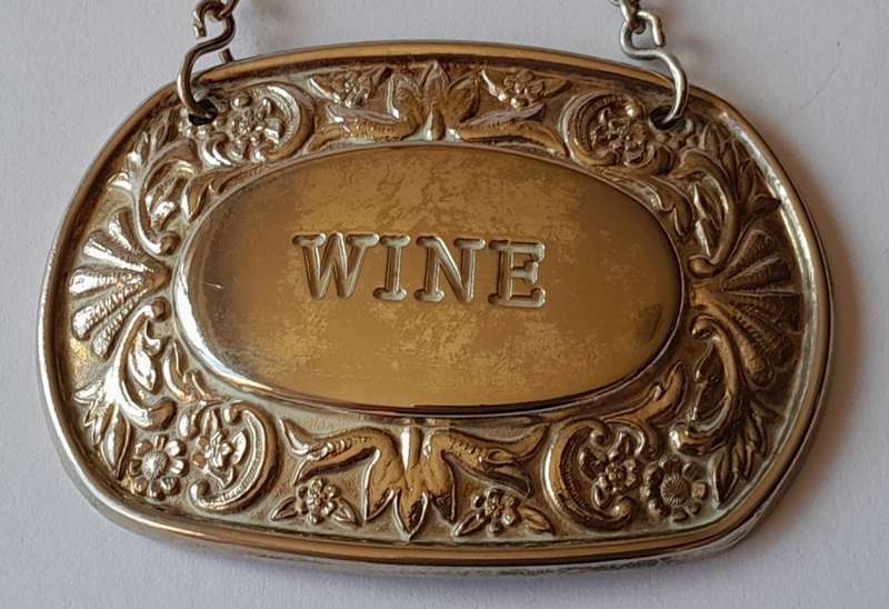 A Vintage Silver Plated `WINE` Bottle Decanter Label By `Ianthe, England`. (2 of 2)