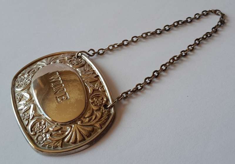A Vintage Silver Plated `WINE` Bottle Decanter Label By `Ianthe, England`. (2 of 2)