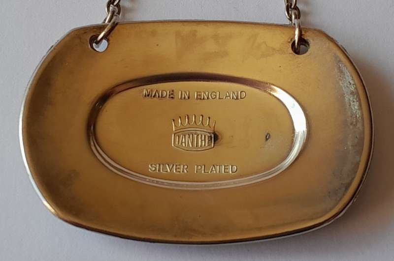 A Vintage Silver Plated `WINE` Bottle Decanter Label By `Ianthe, England`. (2 of 2)