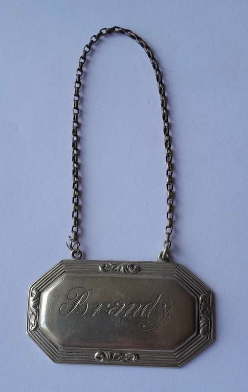 Vintage `Brandy` Decanter Label. Stamped `D&A`.