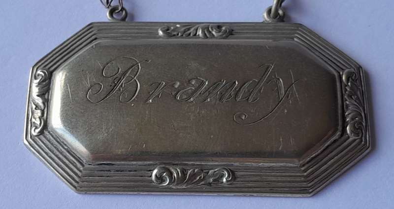 Vintage `Brandy` Decanter Label. Stamped `D&A`.