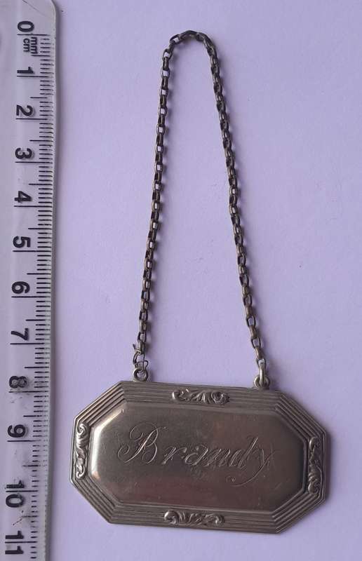 Vintage `Brandy` Decanter Label. Stamped `D&A`.