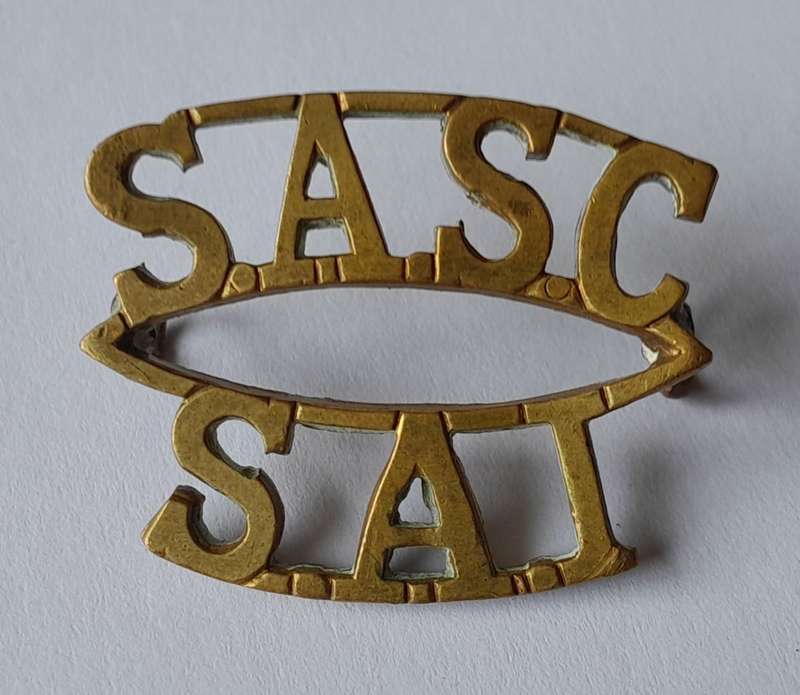 WW2 SA Army Services Corps Shoulder Title.  Lugs Intact.