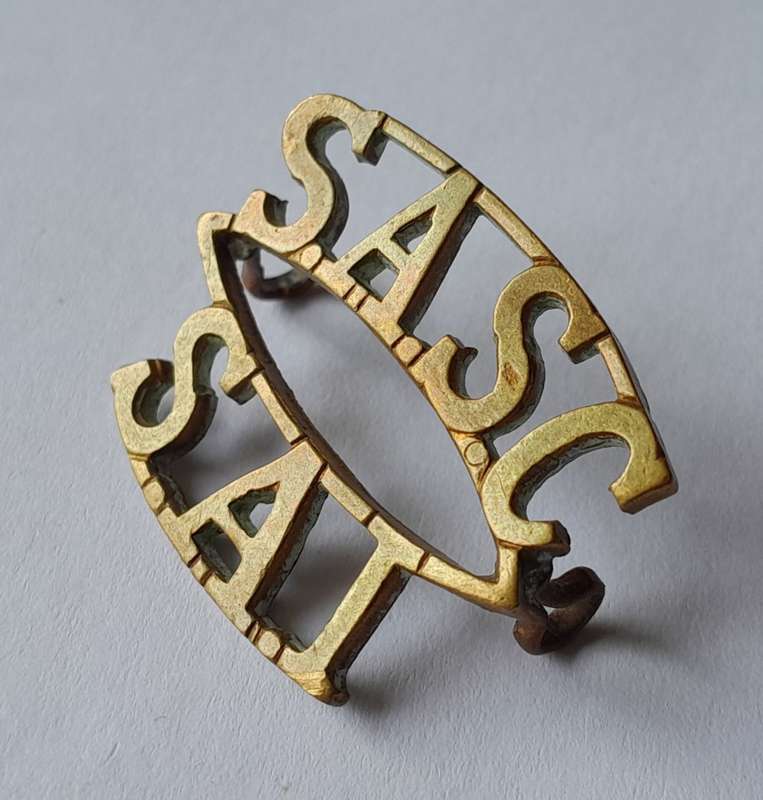 WW2 SA Army Services Corps Shoulder Title.  Lugs Intact.