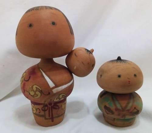 Kokeshi doll family signed by artist