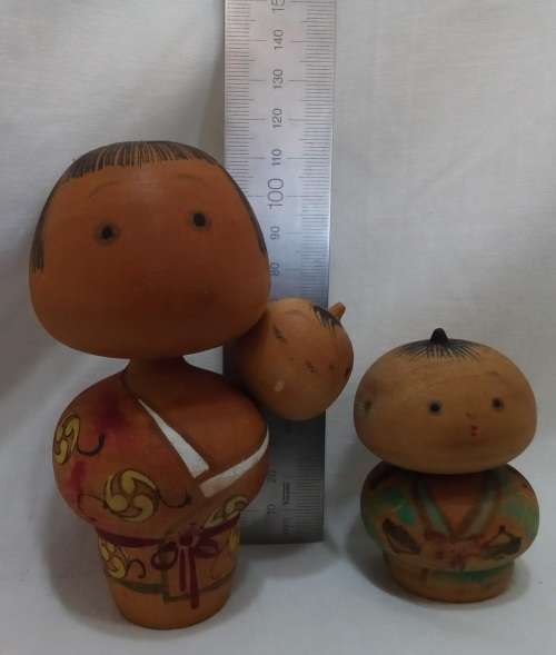Kokeshi doll family signed by artist