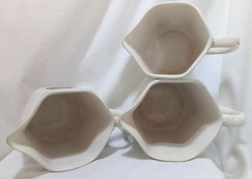 Three stunning vintage trio of Nelson ware pitchers