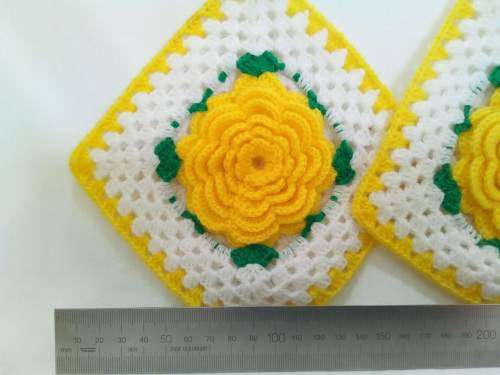 Nostalgia! Crocheted potholders with beautiful yellow flowers.