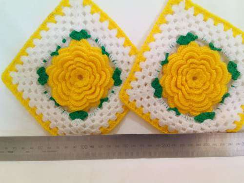 Nostalgia! Crocheted potholders with beautiful yellow flowers.