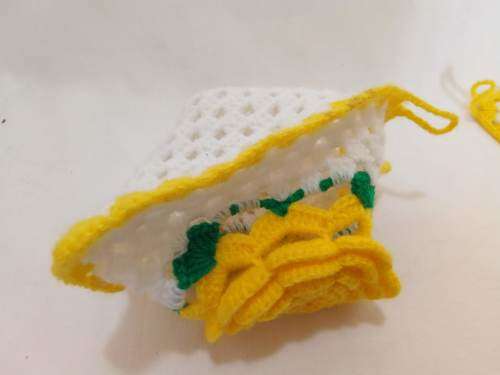 Nostalgia! Crocheted potholders with beautiful yellow flowers.