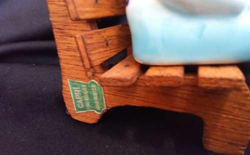 Cutest vintage kissing couple on wooden bench by Balboa