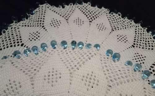 White Vintage crocheted jug cover with turquoise glass beads