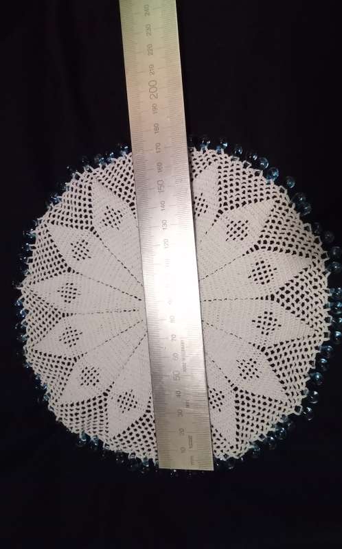 White Vintage crocheted jug cover with turquoise glass beads