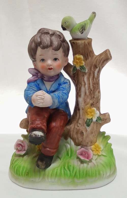 Lovely vintage boy on tree stump figurine in perfect condition