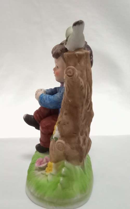 Lovely vintage boy on tree stump figurine in perfect condition
