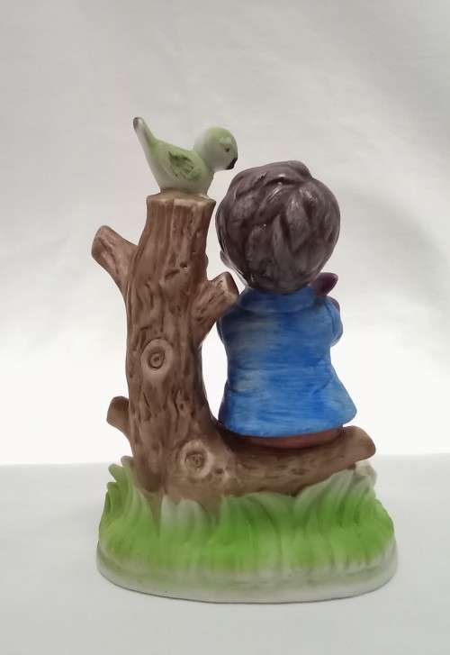Lovely vintage boy on tree stump figurine in perfect condition