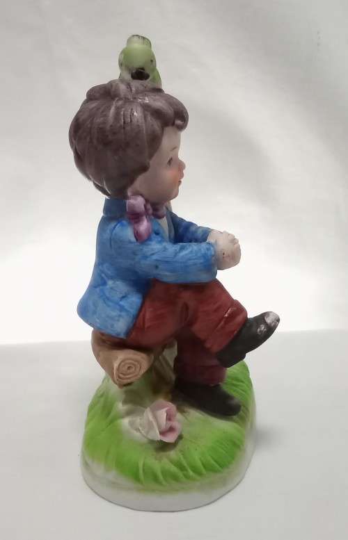 Lovely vintage boy on tree stump figurine in perfect condition