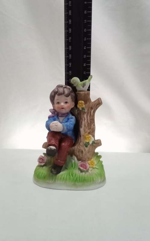 Lovely vintage boy on tree stump figurine in perfect condition