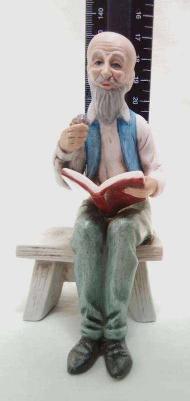 Lovely vintage gentleman on bench figurine in perfect condition