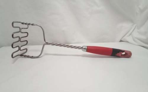 Lovely large vintage wire masher