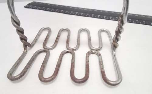Lovely large vintage wire masher