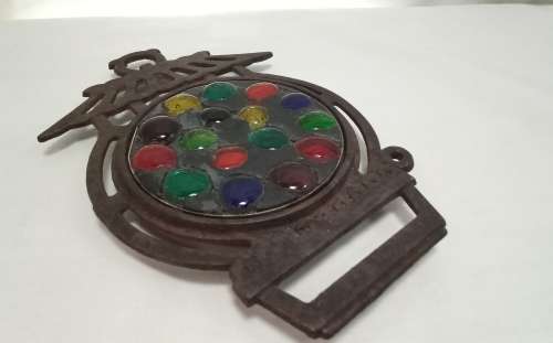Vintage cast iron Trivet with glass  pebbles