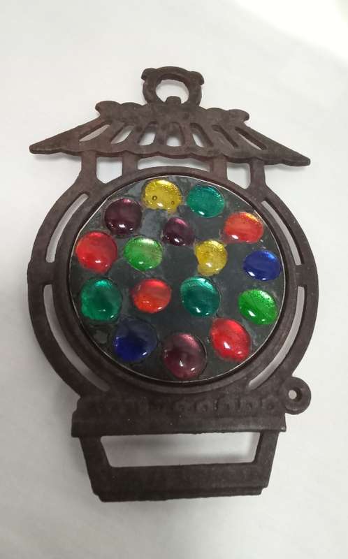 Vintage cast iron Trivet with glass  pebbles