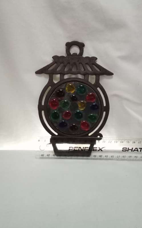 Vintage cast iron Trivet with glass  pebbles