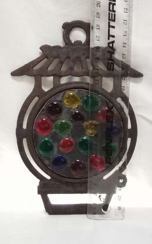 Vintage cast iron Trivet with glass  pebbles