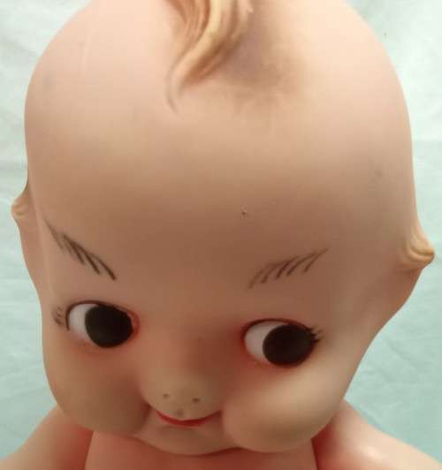 Vintage Kewpie doll with brown eyes