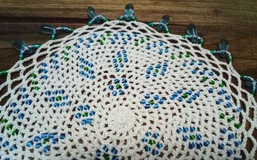 Exquisite vintage doily with turquoise glass beads