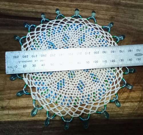 Exquisite vintage doily with turquoise glass beads