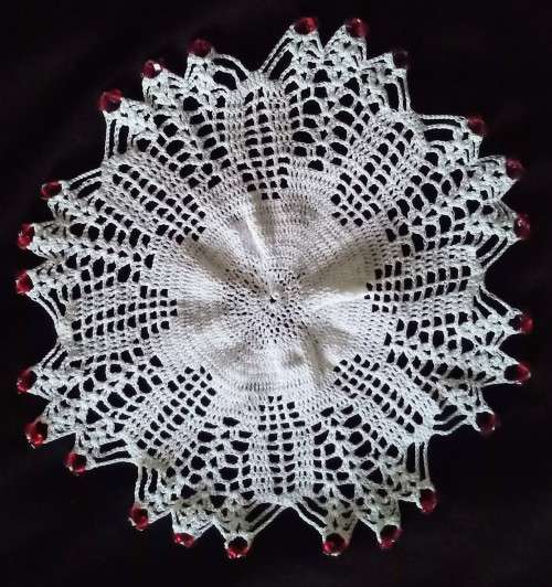 Round Vintage doilie with red beads