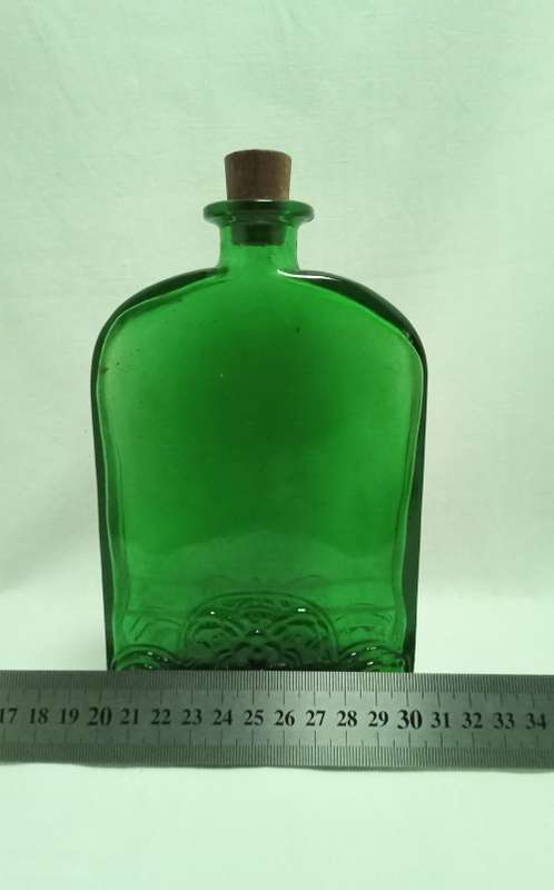 Lovely vintage flat green glass bottle