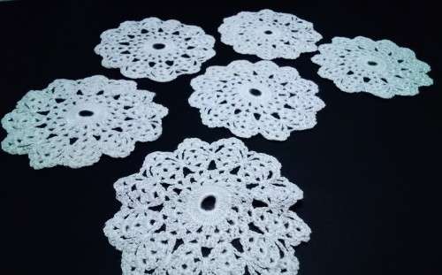 Six vintage small teacup doilies