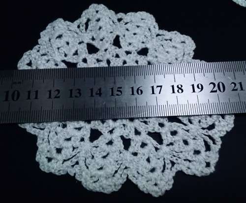 Six vintage small teacup doilies